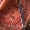 Light weight Lady's Wade Saddle with horse figure and floral tooling with hand painted dyed background all dallied in a Vaquero Lace border